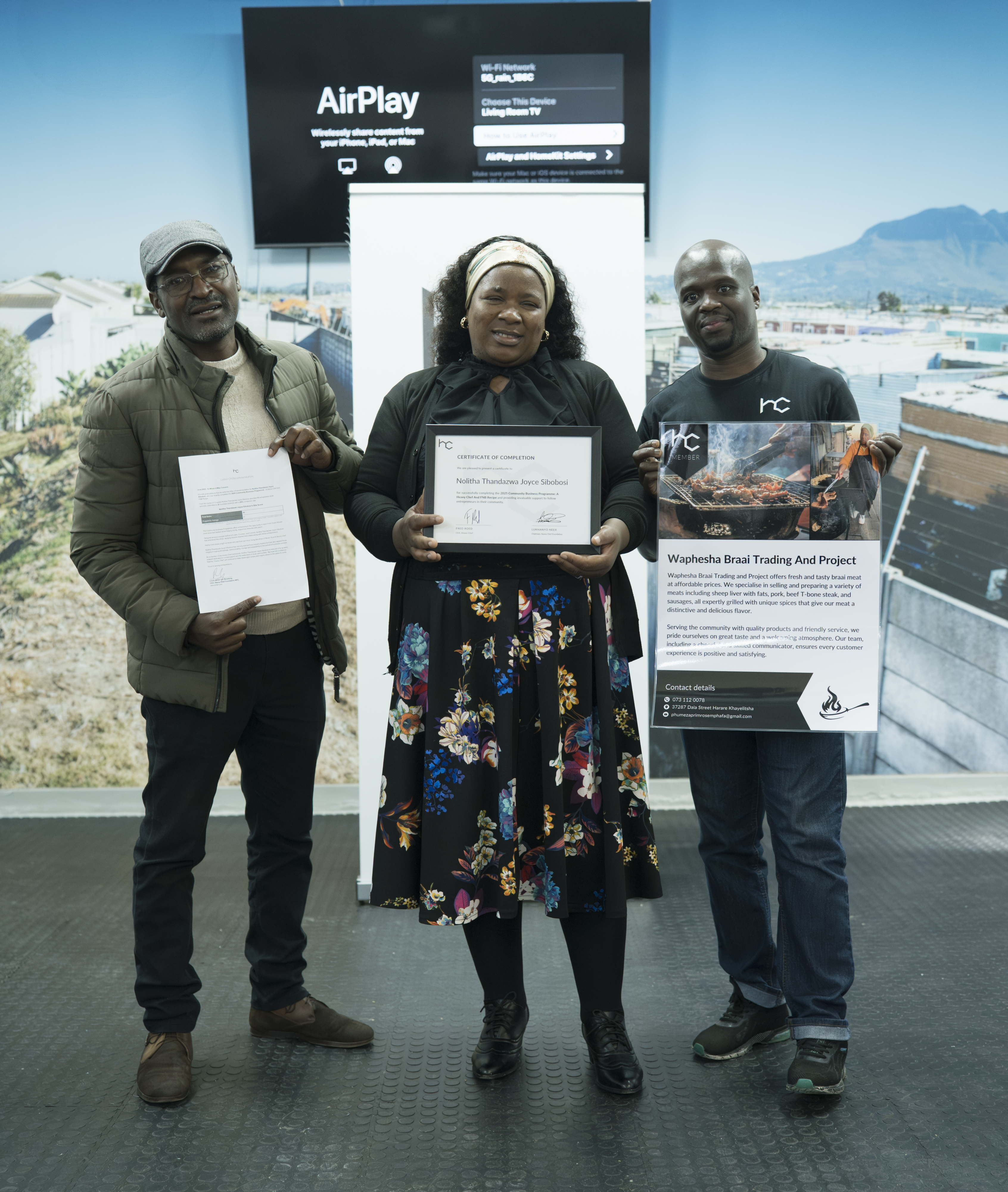 People celebrating at a Heavy Chef partner event with certificates